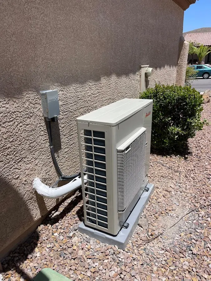 Residential air conditioning condenser unit in Midway